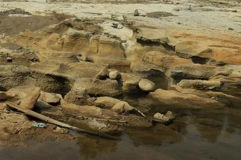 Ancient Rock Formations by a Riverbed Stock Photos