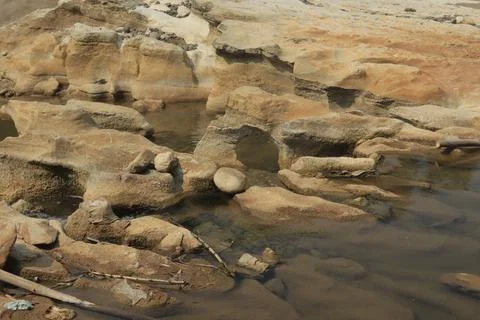 Ancient Rock Formations by a Riverbed Stock Photos