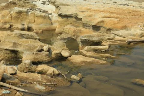 Ancient Rock Formations by a Riverbed Stock Photos