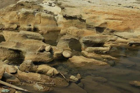 Ancient Rock Formations by a Riverbed Stock Photos