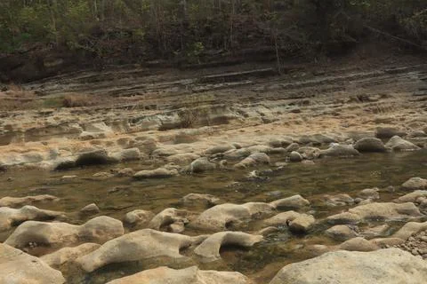 Ancient Rock Formations by a Riverbed Stock Photos