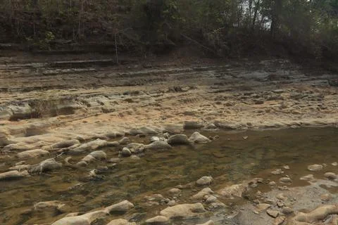 Ancient Rock Formations by a Riverbed Stock Photos