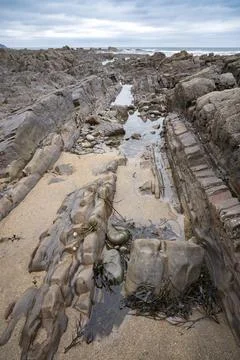 Ancient rocks on Widemouth beach Cornwall Foto stock