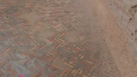 Ancient Roman Herringbone Brick Floor at Archaeological Site Stock Footage 338008345