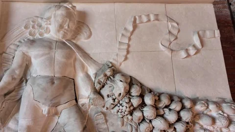 Ancient Roman marble bas-relief with putto and garland in Rome Italy Stock Footage 338182944