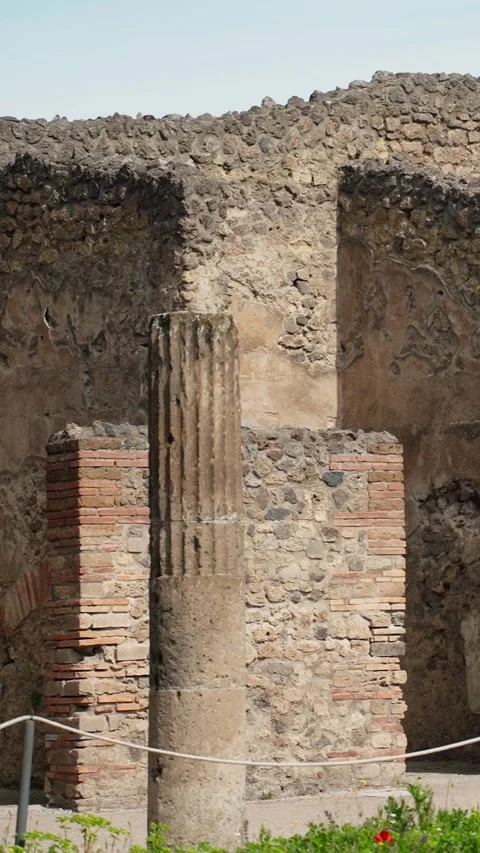Ancient Roman ruin with a fluted stone column, brick masonry, and weathered Stock Footage 336214608
