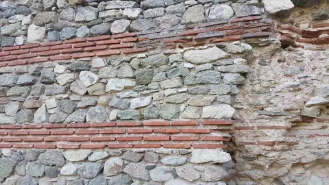 Ancient Roman wall with layers of brick and stone Vídeos de archivo 97206701