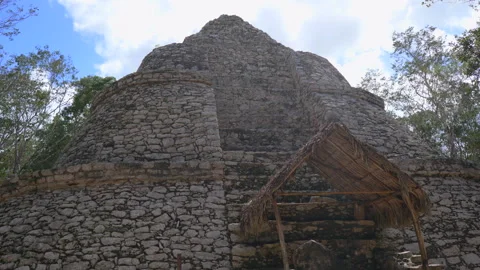 Ancient ruins of Mayan pyramids at the archaeological site of Coba on the Stock Footage 343885070
