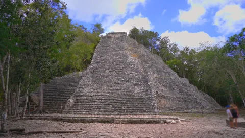 Ancient ruins of Mayan pyramids at the archaeological site of Coba on the Stock Footage 343970838