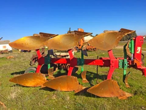 Ancient rusty plow on a village Stock Photos