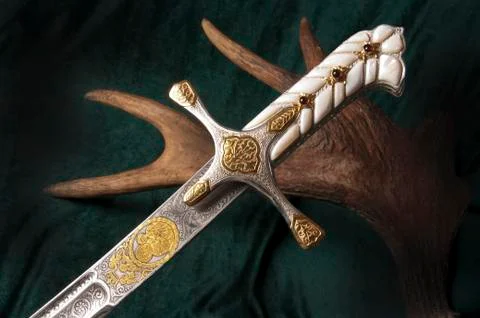 Ancient sabre on white Stock Photos