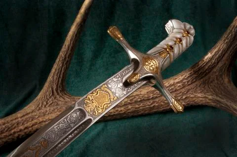Ancient sabre on white Stock Photos