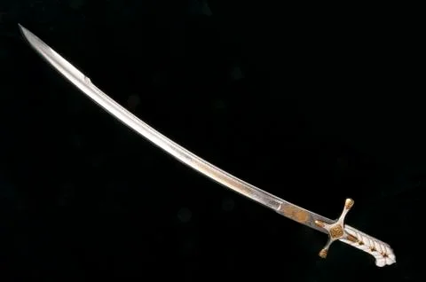 Ancient sabre on white Stock Photos