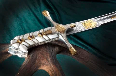Ancient sabre on white Stock Photos