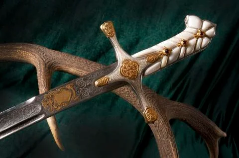 Ancient sabre on white Stock Photos