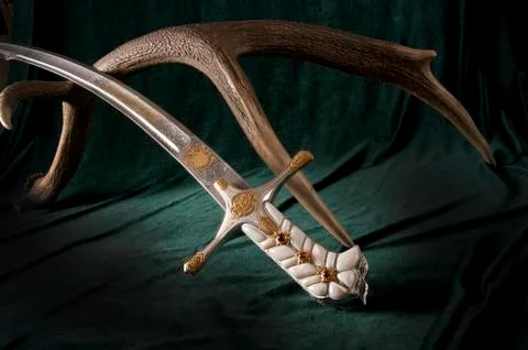 Ancient sabre on white Stock Photos
