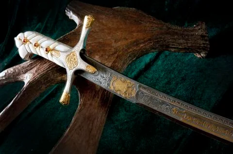 Ancient sabre on white Stock Photos