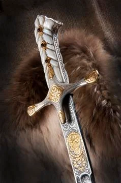 Ancient sabre on white Stock Photos