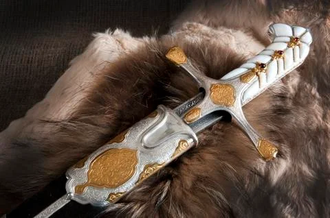 Ancient sabre on white Stock Photos