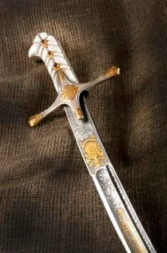 Ancient sabre on white Stock Photos