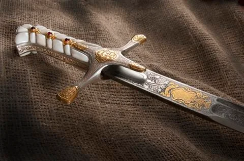 Ancient sabre on white Stock Photos