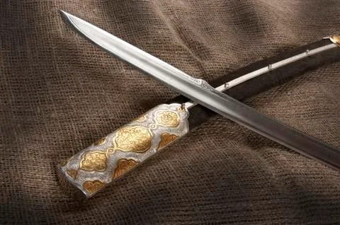 Ancient sabre on white Stock Photos