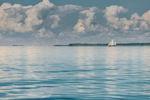 Ancient sail ship, magic reflections on water surface, sailing regatta in the Stock Photos