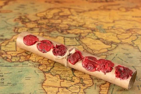 Ancient scroll with seven seals on an old world map, Christian prophecy Stockfoto's