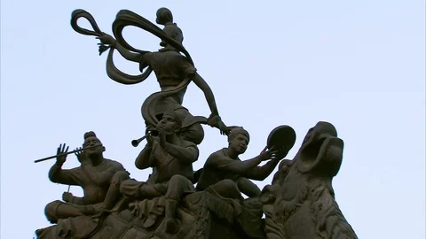 Ancient sculpture in front of palace Stock Footage 88545730
