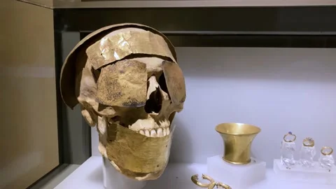 Ancient skull decorated with gold Stock Footage 237284245