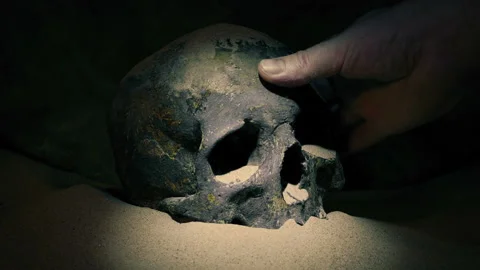 Ancient Skull Is Found With Torch And Picked Up Stock Footage 189928762