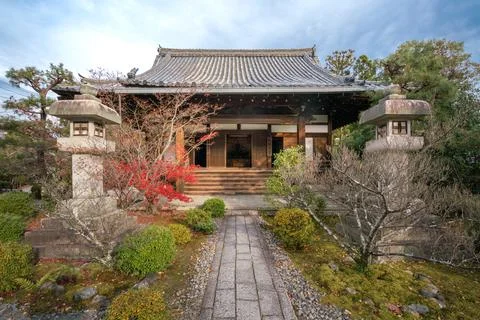 Ancient, small Buddhist shrine with stone lamps and small Japanese garden in Stock Photos
