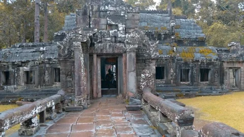Ancient small stone Khmer style temple standing under the trees Stock Footage 318723713