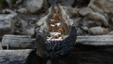 An ancient source of meltwater in the mountains. Close-up. Video stock 121485206