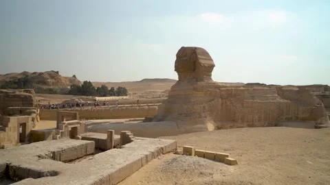 Ancient Sphinx monument with pyramid backdrop at Giza, Egypt. Historic arch.. Stock Footage 313959016
