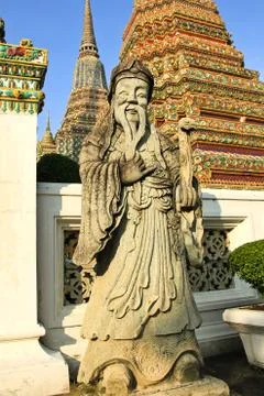 Ancient statue in the complex of wat pho, the temple of the reclining buddha Stock Photos