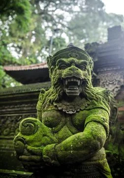 Ancient statue in monkey forest bali indonesia Stock Photos