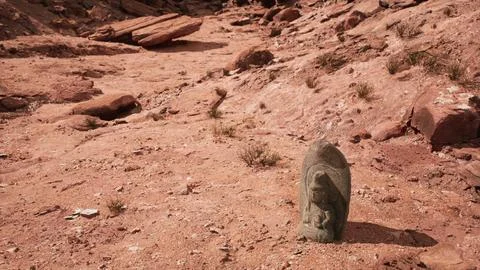 Ancient Statue on the Rocks Desert Ilustración de archivo
