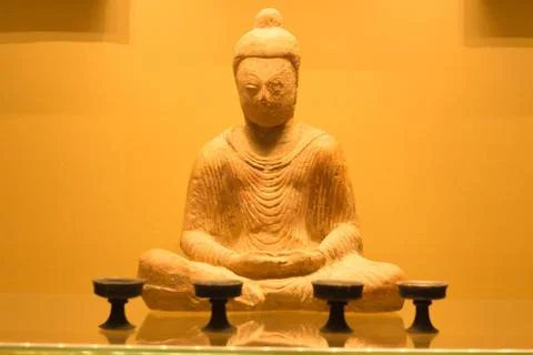 The ancient statue of the thinker Buddha is made of durable stone material Stock Photos