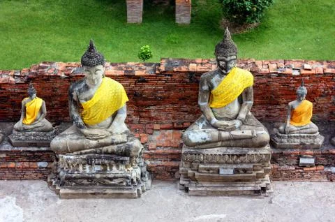 Ancient statues of Buddha of different sizes, in the old temple of Wat Yai Ch Stock Photos