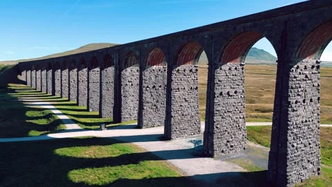 Ancient stone aqueduct spans rolling green hills. Yorkshire Dales,  Ribbleh.. Stock Footage 346295439