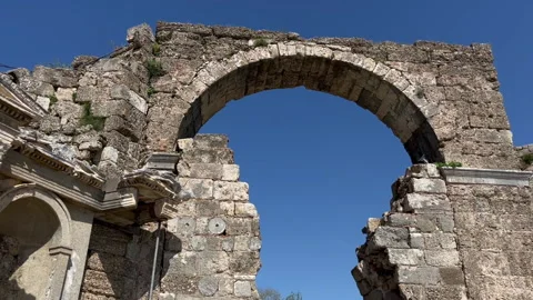 Ancient Stone Arch with Blue Sky Panning Stock Footage 180408815