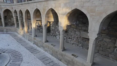 Ancient stone arched colonnade at Bazar Square in Baku Old City Stock Footage 339065124
