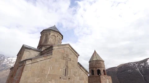 Ancient stone architecture of Gergeti Trinity Church in Georgia Stock Footage 340328196
