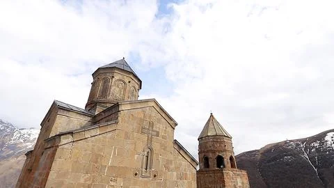 Ancient stone architecture of Gergeti Trinity Church in Georgia Stock Photos