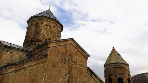 Ancient stone architecture of Gergeti Trinity Church in Georgia Stock Photos