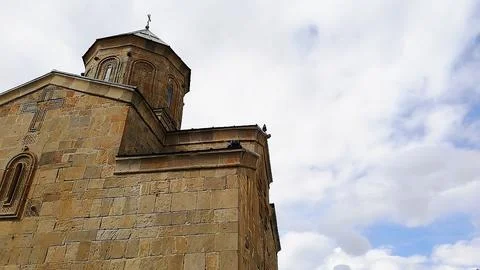 Ancient stone architecture of Gergeti Trinity Church in Georgia Stock Photos