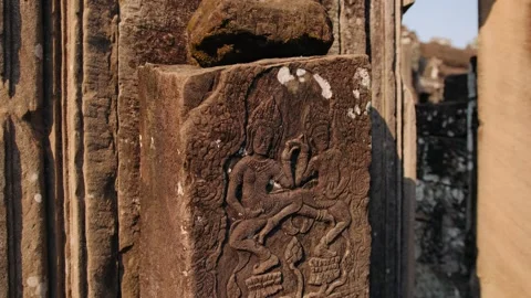 Ancient stone bas relief carving of traditional apsara dancers on a pillar Stock Footage 326109808