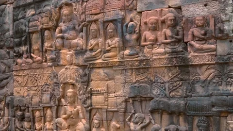 Ancient stone bas-relief depicting people and different mythical creatures Stock Footage 318657092