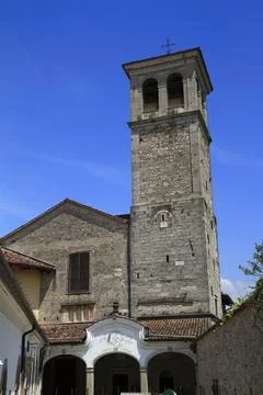 Ancient Stone Bell Tower Under Blue Sky, Cividale del Friuli, Italy Stock Photos